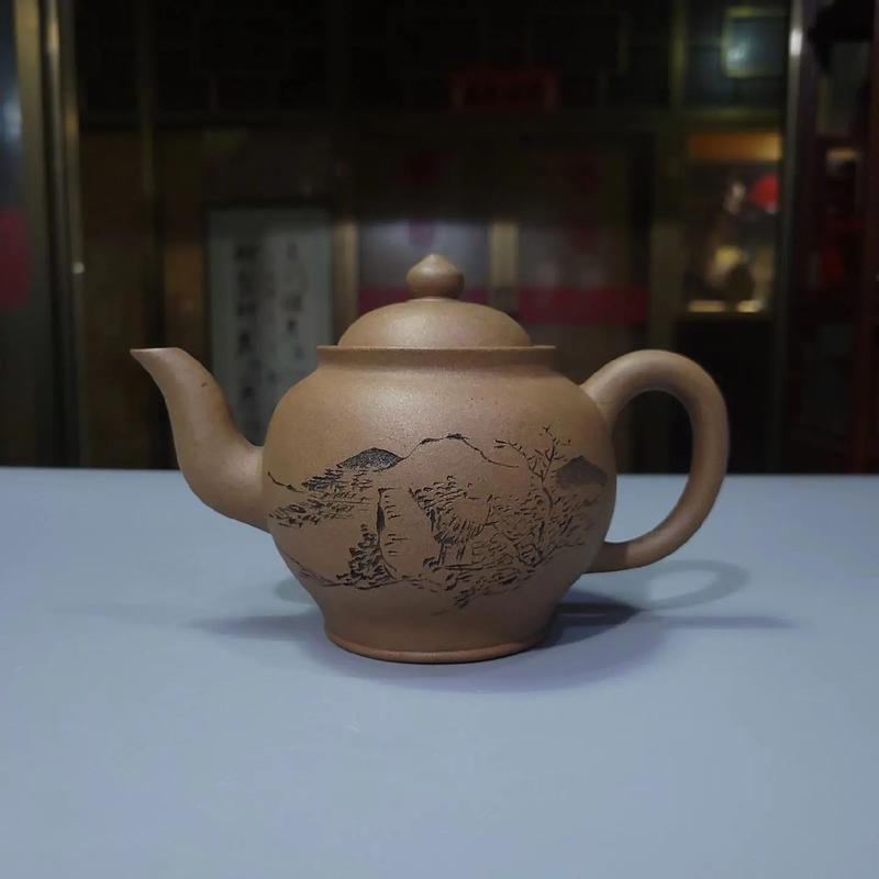 石泉刻千禧紫砂壶图片