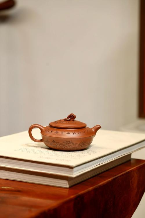 紫砂壶刻绘黑色会掉吗